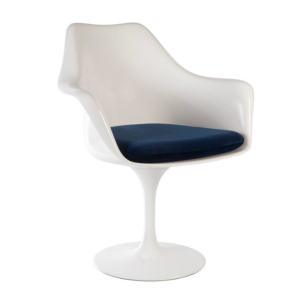 A Saarinen Tulip Arm Chair in a super high quality fibreglass seen simply at a three quarter angle, proudly displaying deep ocean blue seat cushion