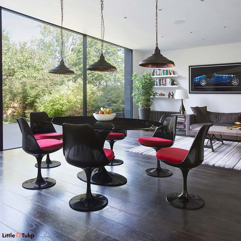 They say opposites attract & the Nero Marquina Black Marble 170 cm Tulip Table & 6 Black Side Chairs with red fabric are the polar of the original white 