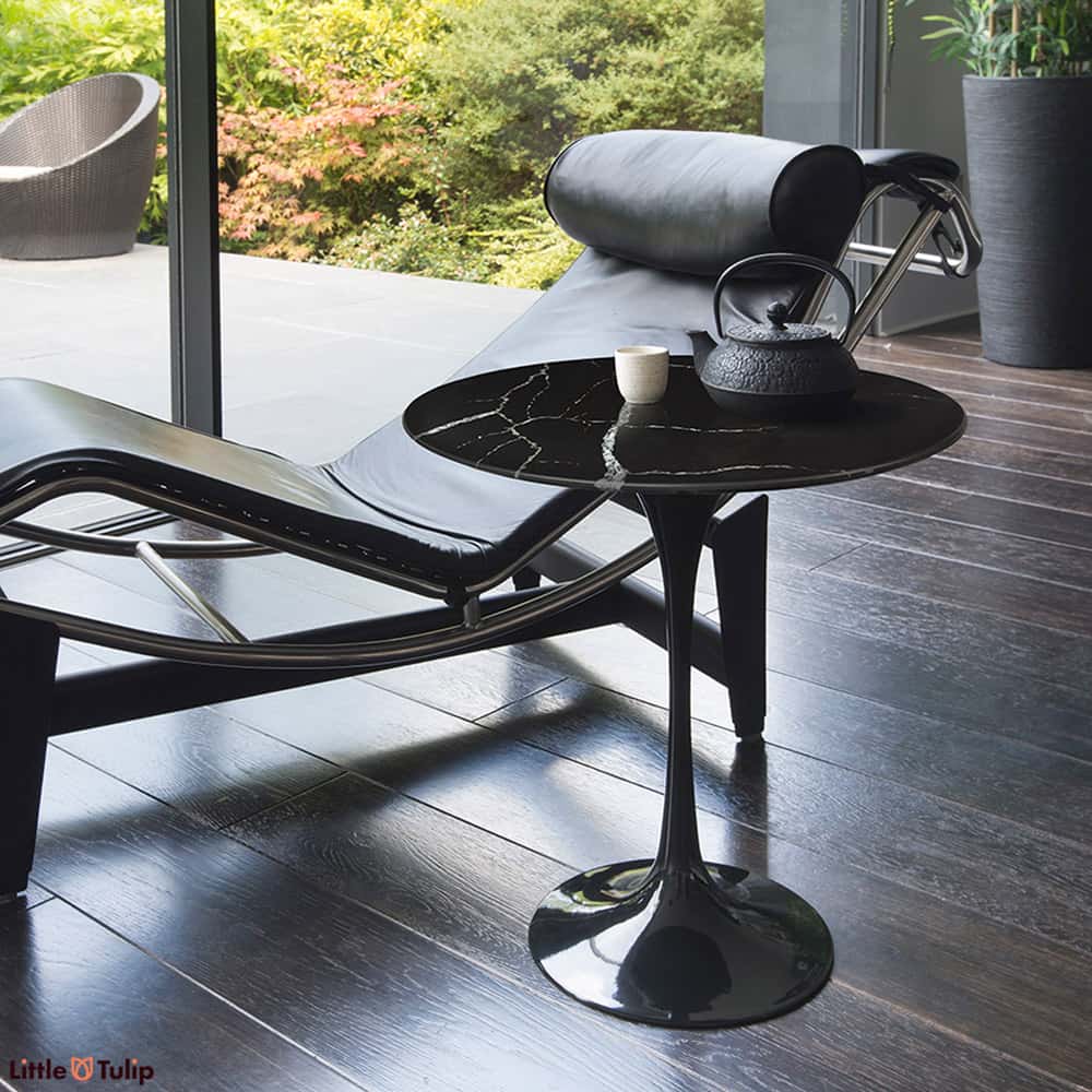 A Tulip Side Table, like this with a Nero Marquina top, is so remarkably versatile next to a sofa, a bed, a chair or holding your favourite books or plants