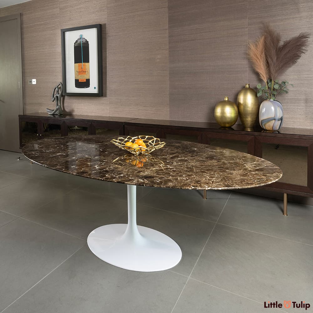 Minimalist, we see this resplendent 198 emperador Tulip table sat in this reserved drawing room as its main feature