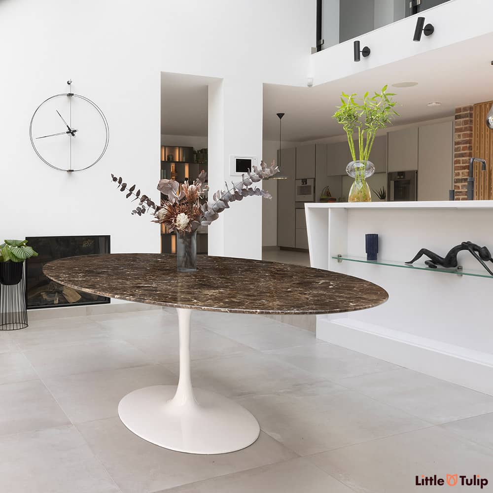 There is something wonderfully textured about this large oval Tulip Table in Emperador Marble as its wonderful top stands out amazingly from the white walls