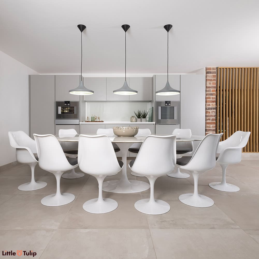 8 sides, 2 arms with grey cushions and an Arabescato dining table enhance the modern kitchen with its silver furnishings
