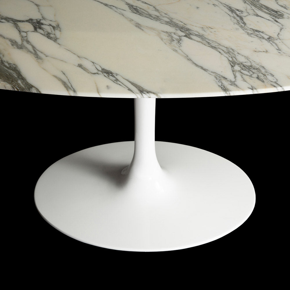 As seen from a top down and angled view, the pure brilliance of the natural Arabescato Marble can be seen on this 170 x 110 oval Saarinen Tulip Table
