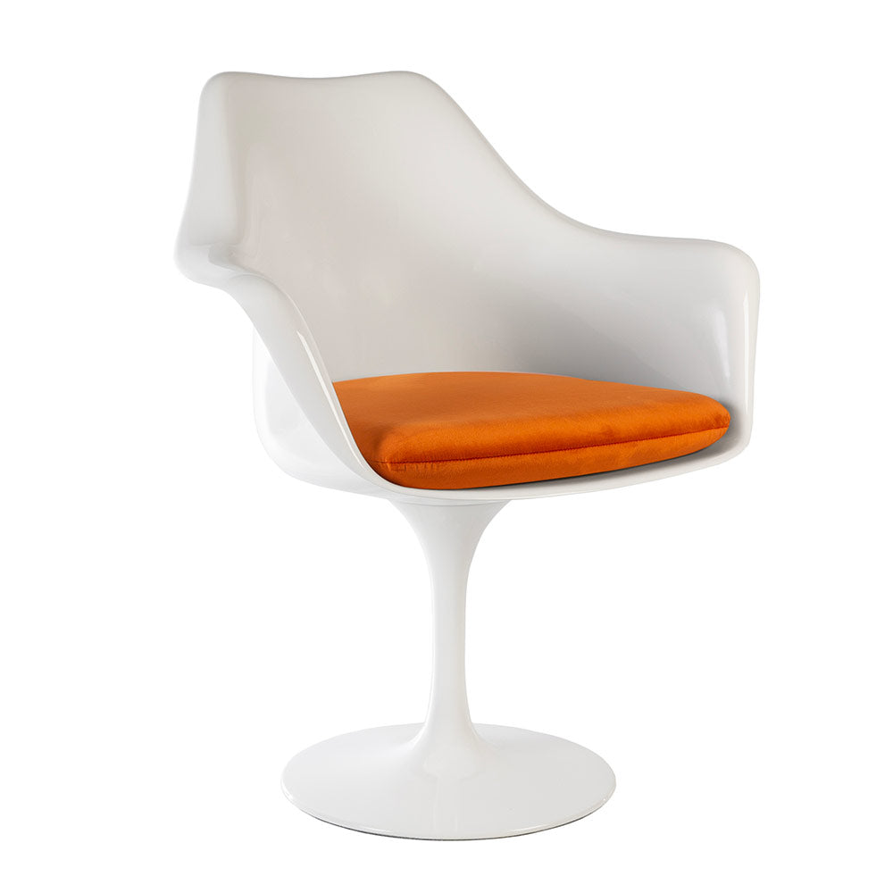 A Saarinen Tulip Arm Chair in a super high quality fibreglass seen simply at a three quarter angle, proudly displaying its flame orange seat cushion too