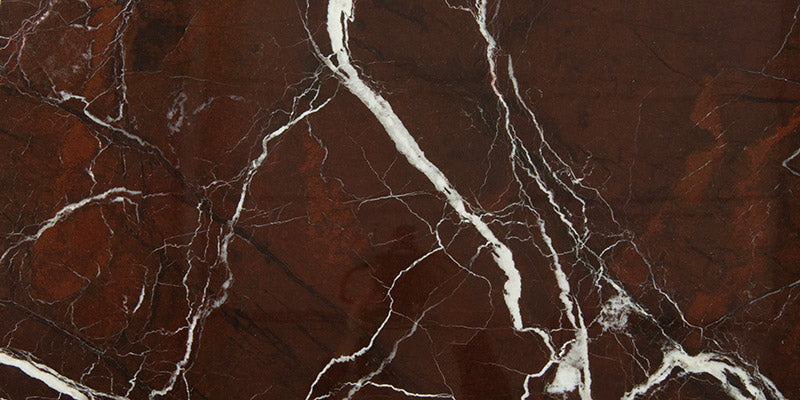 The wonderful Levanto Rosso marble, a deep purplish red stone crossed with natural veins of white, natural quartz and form