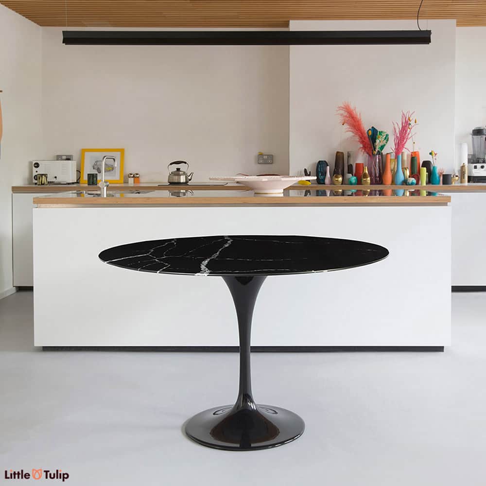 Nero Marquina provides that wonderful jet black base interlaced with thunderbolts of mother of pearl white veining, perfect on this 120 cm Tulip Table