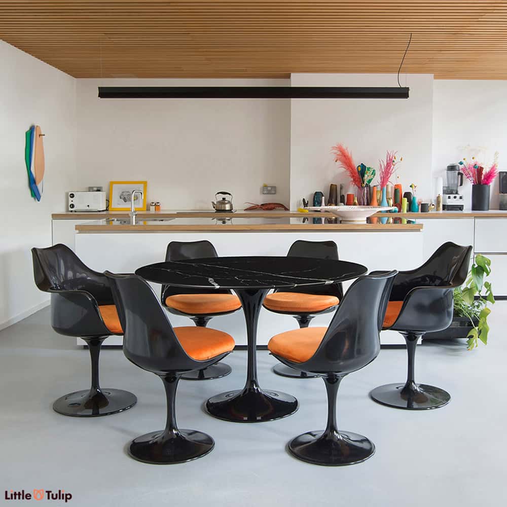 Some designs make a wow statement the moment you set eyes on them, just like this set of Nero Marquina 120 Tulip Table & 6 Tulip Chairs with orange cushions