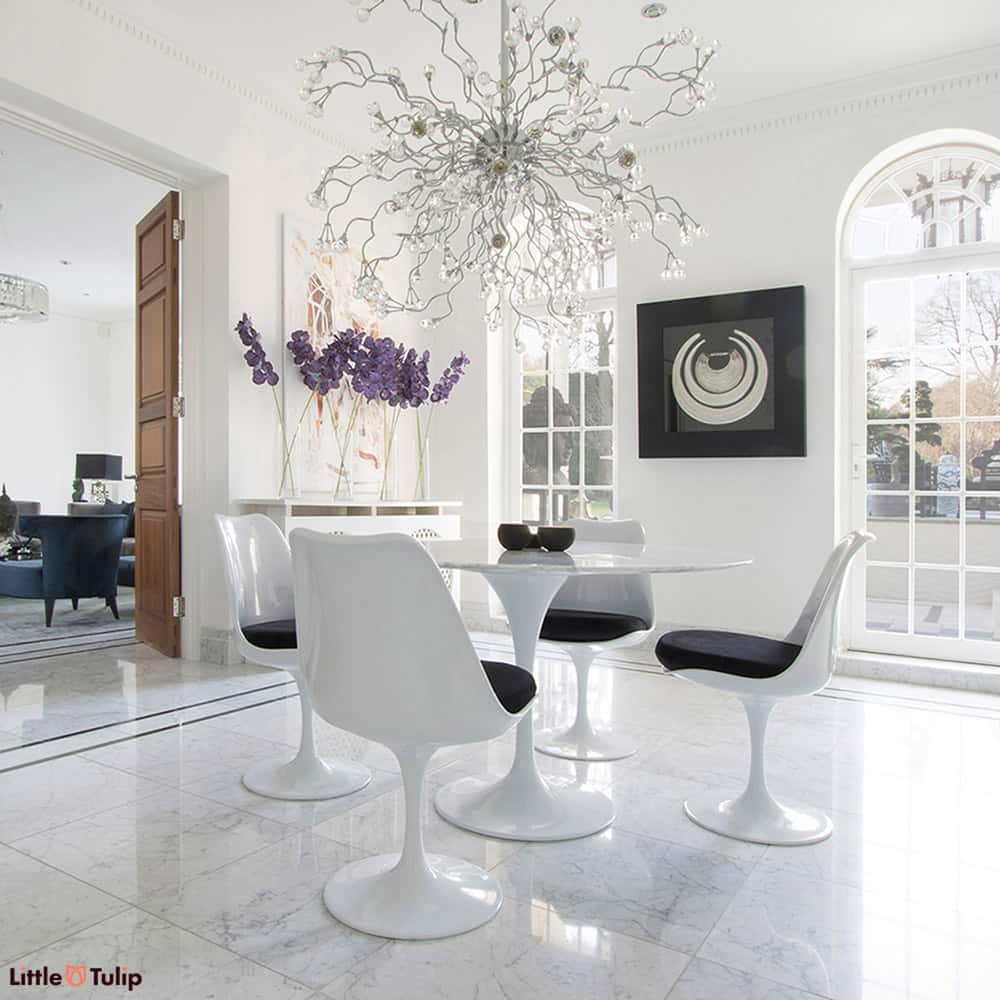 Make the ultimate statement with a table made with pure Carrara Marble, seen here on a 120cm Tulip Table and 4 matching Tulip Chairs with Black cushions