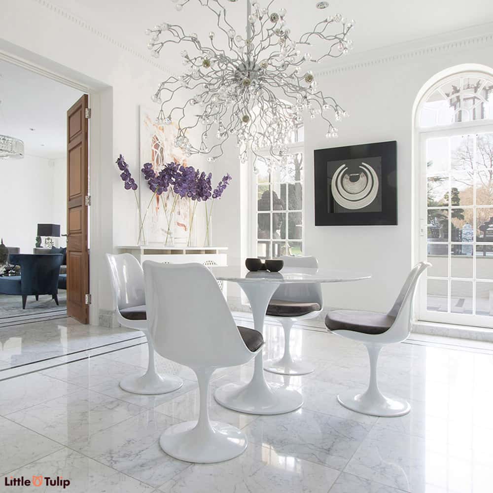 Make the ultimate statement with a table made with pure Carrara Marble, seen here on a 120cm Tulip Table and 4 matching Tulip Chairs with Grey cushions
