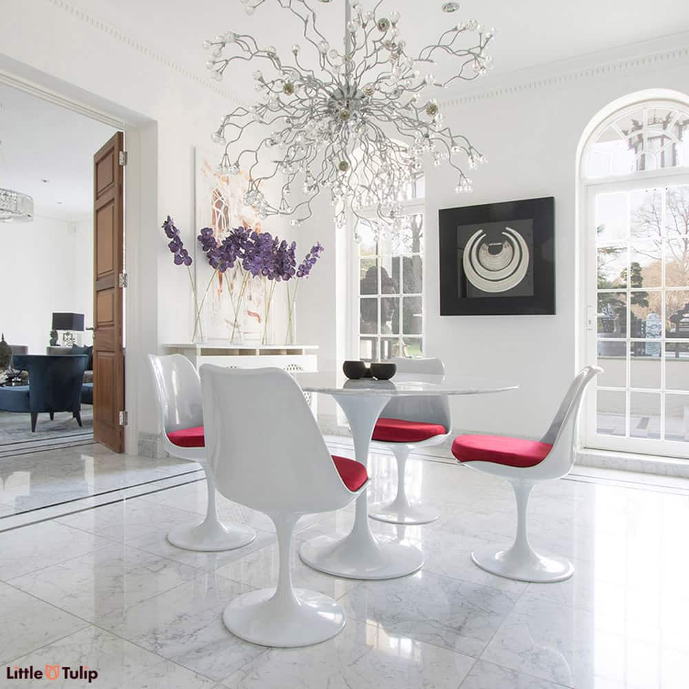 Make the ultimate statement with a table made with pure Carrara Marble, seen here on a 120cm Tulip Table and 4 matching Tulip Chairs with Red cushions