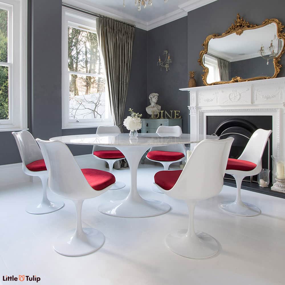 Homely tones radiate from this super cool 170 cm White Carrara Marble Tulip Table paired together with six of the matching side chairs with red cushions