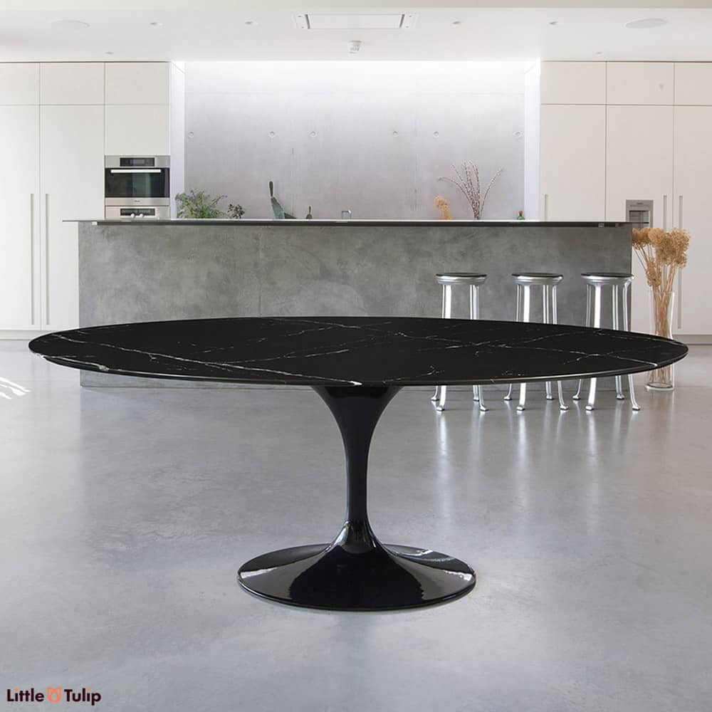 Polarize the classic Saarinen Tulip Table and you get this wonderful centre of attention, a 200 cm Oval Tulip Dining Table in Nero Marquina marble