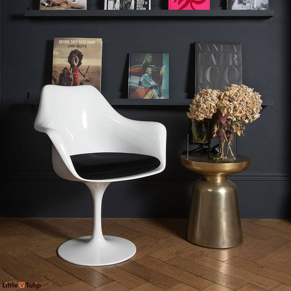 A chair as timeless as a design can be, a Saarinen Tulip Arm Chair, here with a black velveteen cushion, is the essence of design that simply never ages