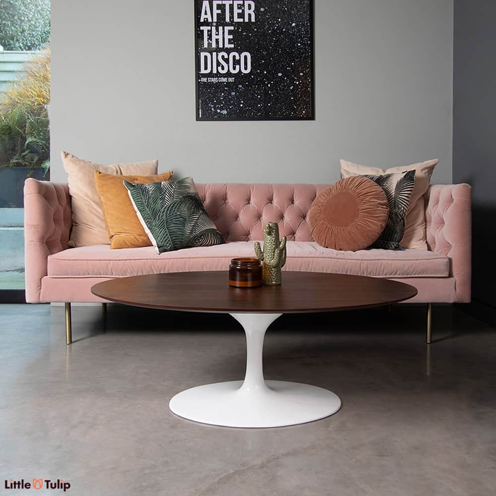 The real Walnut Veneer top of this oval Tulip Coffee Table adds a real depth of warmth to the modern living space seen here with lilac sofa