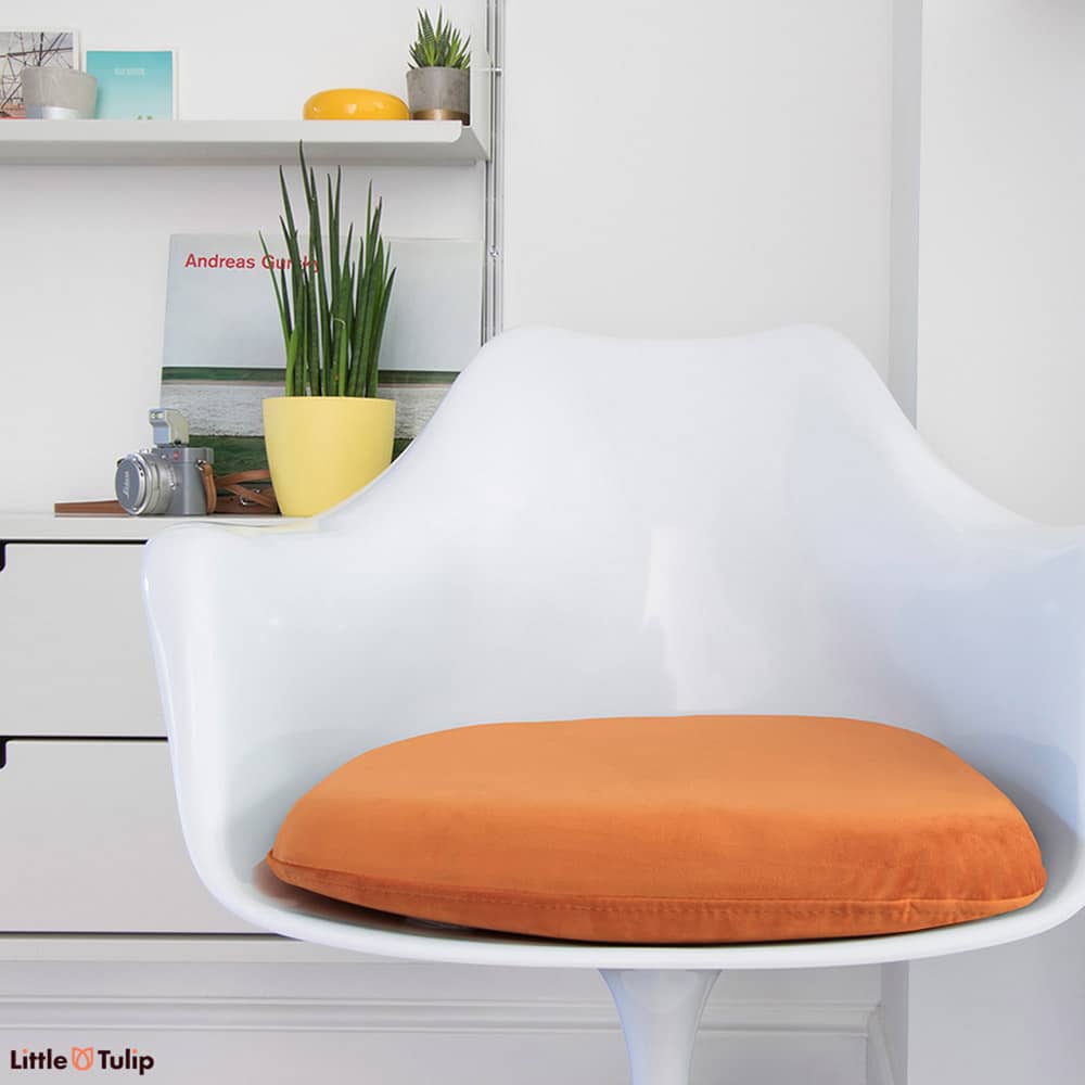 The seat pad for the Tulip Arm Chair, is no ordinary pillow, but a beautiful soft to the touch cushion in an eye catching and stunning orange luxury fabric