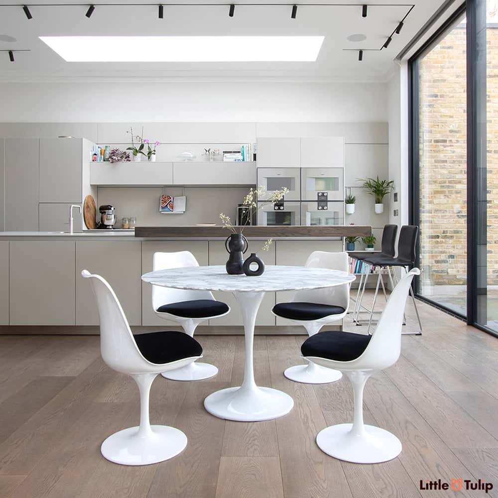 A beautifully finished modern kitchen finished in spectacular style with a 120 cm Tulip Table in Arabescato Marble & 4 side chairs with jet black cushions