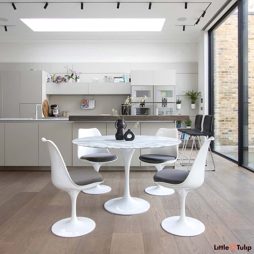 A beautifully finished modern kitchen finished in spectacular style with a 120 cm Tulip Table in Arabescato Marble & 4 side chairs with medium grey cushions