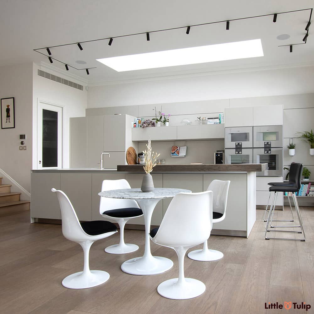 Is this the perfect kitchen? It could well be, the Arabescato 90 cm Tulip Table & side chairs with granite black cushions are simply divine in this space