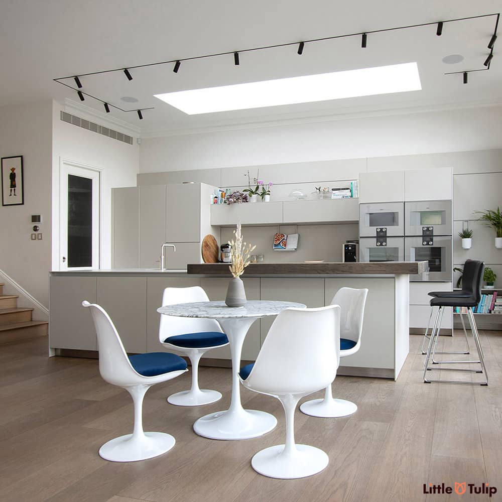 Is this the perfect kitchen? It could well be, the Arabescato 90 cm Tulip Table & side chairs with vivid blue cushions are simply divine in this space
