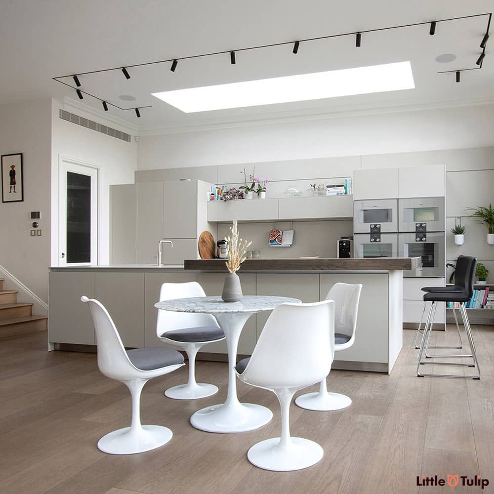 Is this the perfect kitchen? It could well be, the Arabescato 90 cm Tulip Table & side chairs with smooth grey cushions are simply divine in this space