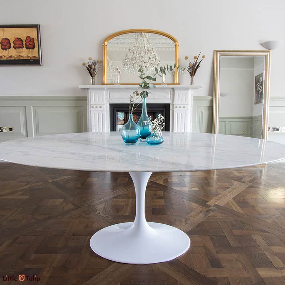 What a grand showpiece this 200 cm Oval Saarinen Tulip Table is showcasing a top made from solid Carrara Marble predominantly white with grey veins
